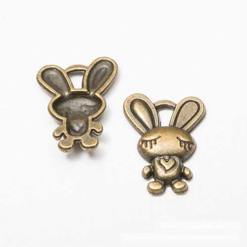 Close front view showing the shape and recessed details of the heart holding bunny charms