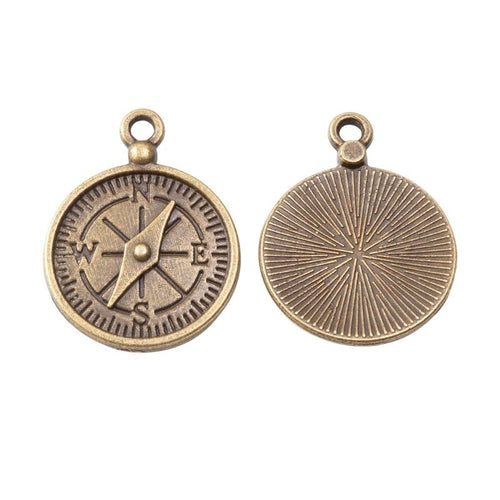 Close view of the relief and openwork details on the detailed compass metal charm