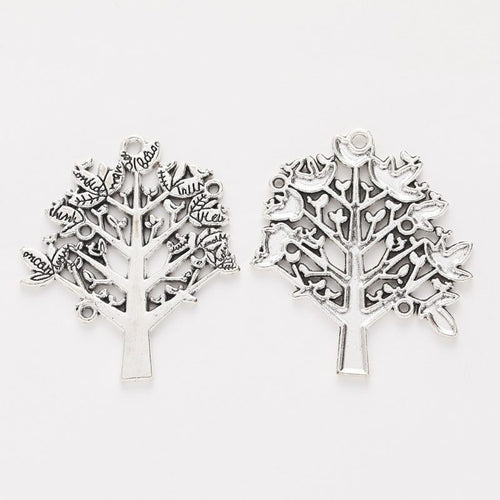 Close view showing the front and reverse details of the branching tree charm