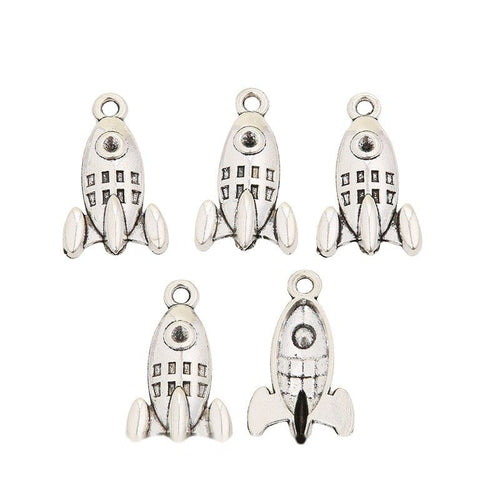 Closer view of the retro rocket charm surface and hanging loop