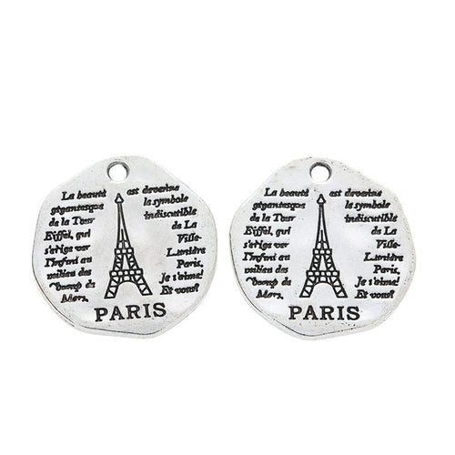 Front detail of paris eiffel tower round metal charm