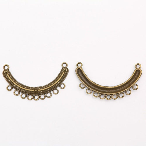 Close view of the relief and openwork details on the curved beaded chandelier connector