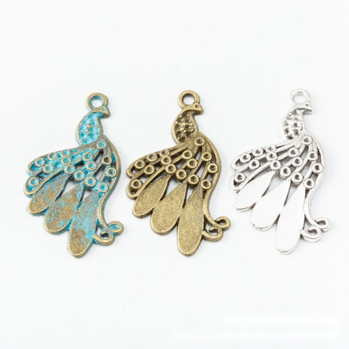 Front and reverse views of the openwork peacock connector in one finish