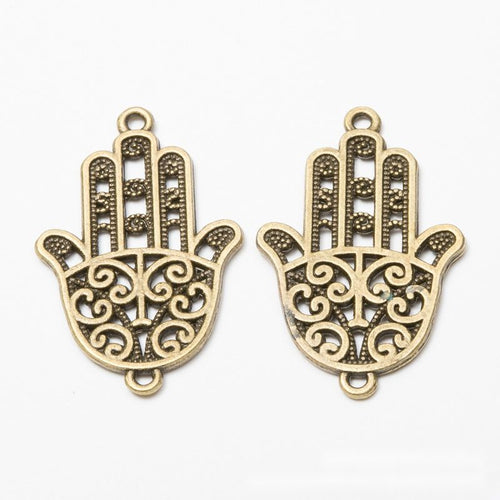 Close view showing the front and reverse details of the filigree hamsa hand connectors