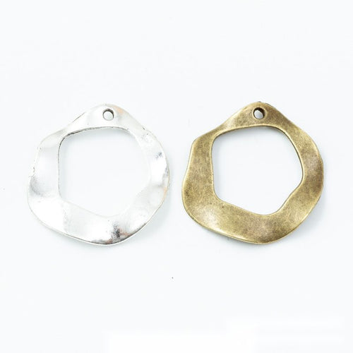 Irregular open circle and teardrop charms shown in product image 2