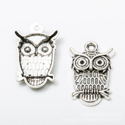 Front and reverse view of the owl charm