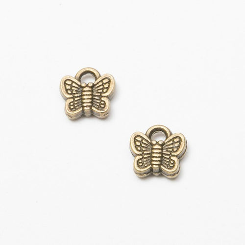 Front and reverse views of the tiny butterfly in one finish