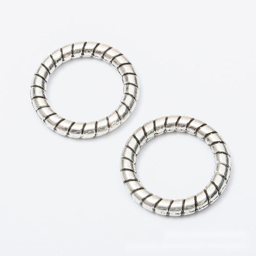 Round link component shown in front and reverse details