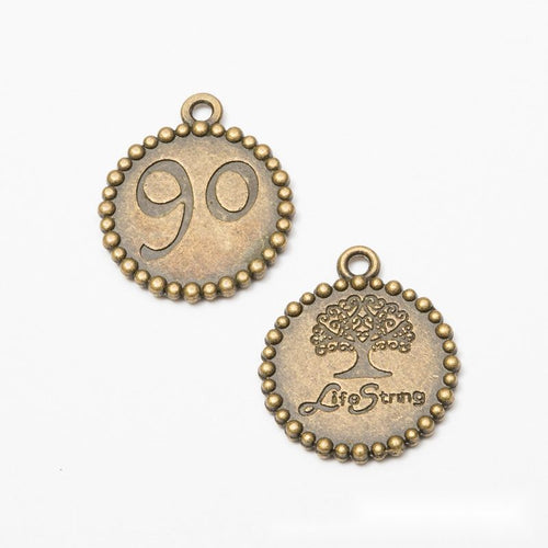 Close view of round tree of life charm