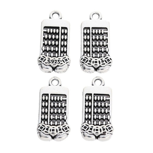 Grouped front and back views showing the details of double abacus charms