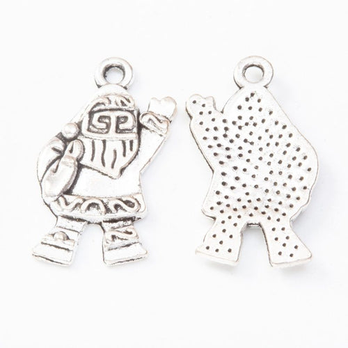 Closer view of the standing Santa figure with engraved suit and textured reverse