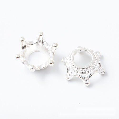 Closer product view of crown-shaped round bead cap shown against a plain background.