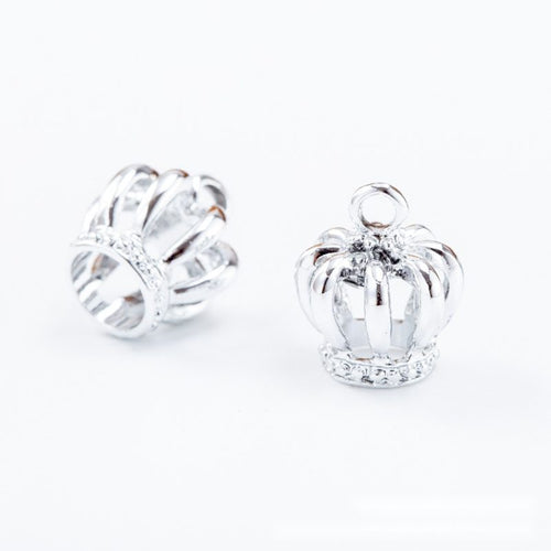 Mini Openwork Crown Charm shown from the front in contrasting finishes