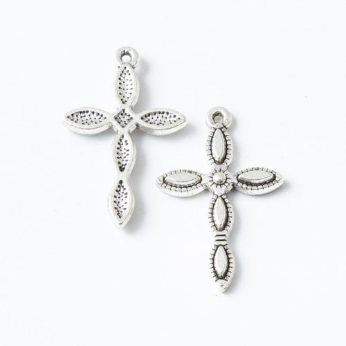 Angled detail views of leaf cross charms
