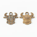 Ox Head Charm with Engraved Face in Two Antique Finishes view 2