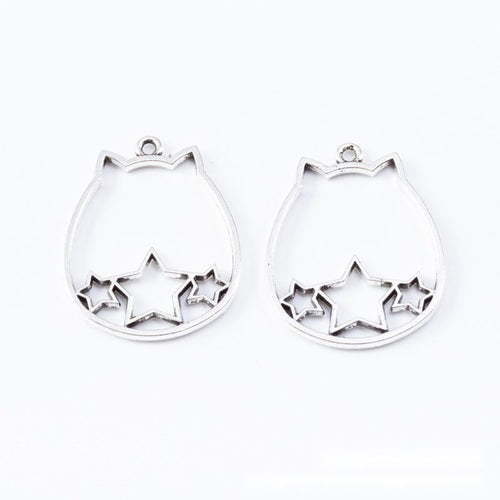 Close product view showing the front and reverse details of the cat outline open bezel
