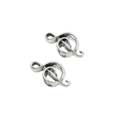 Detail view of treble clef large-hole bead showing finish variation 2
