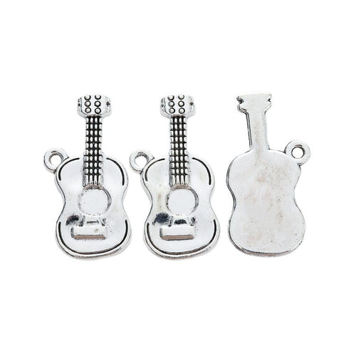 Detail view of acoustic guitar charm showing finish variation 2