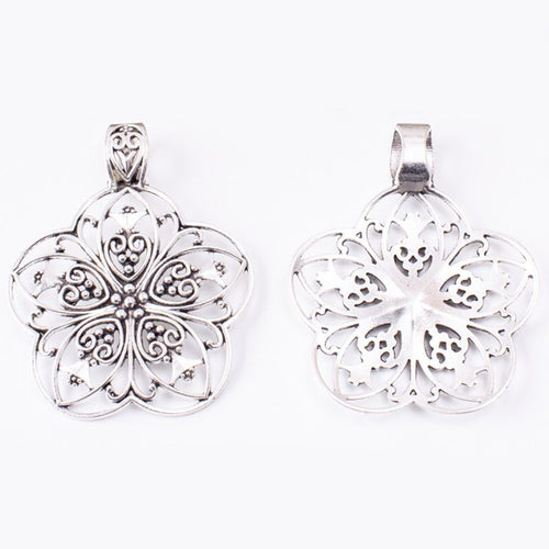 Filigree Flower Medallion Pendant front detail showing a layered round flower with pierced petals