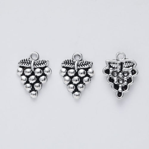 Closer view of the small grape cluster charm surface and hanging loop