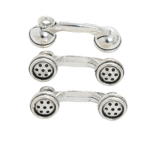Grouped front and back views showing the details of telephone receiver charms