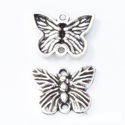 Two-loop butterfly connector metal component, front and reverse detail on white