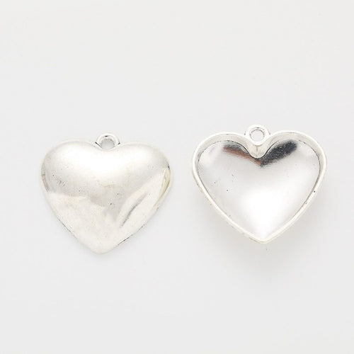 Broken-heart relief charm opened to show the matching hollow interior
