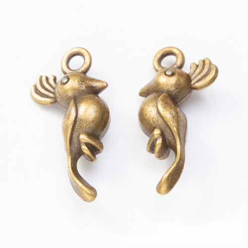 Close product view of the long tailed bird metal charm in two antique finishes