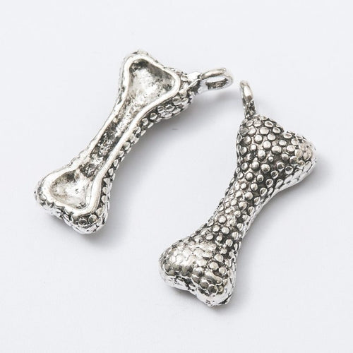 Textured Dog Bone metal piece showing front-facing surface and relief detail