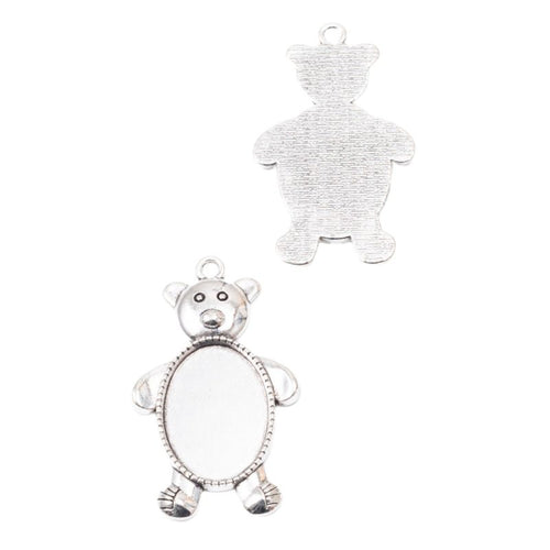 Front detail of teddy bear with an oval recessed cabochon tray