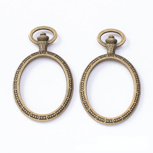Closer view of the oval recessed setting with a beaded rim and round top loop