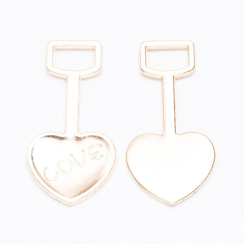 LOVE heart shovel metal component, front and reverse detail on white