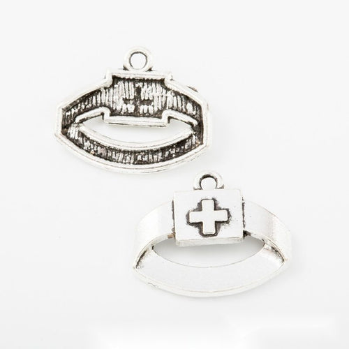Three medical charm designs arranged together on a white background.