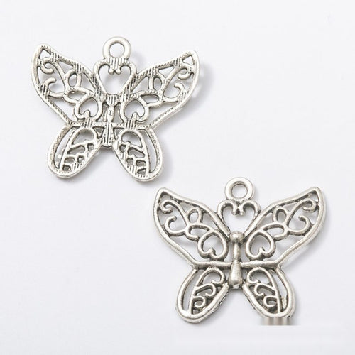 Openwork Floral Butterfly Charm Pendant front detail showing scrolling floral cutouts across both wings