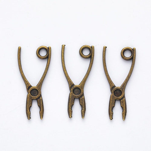 Angled detail views of pliers charms