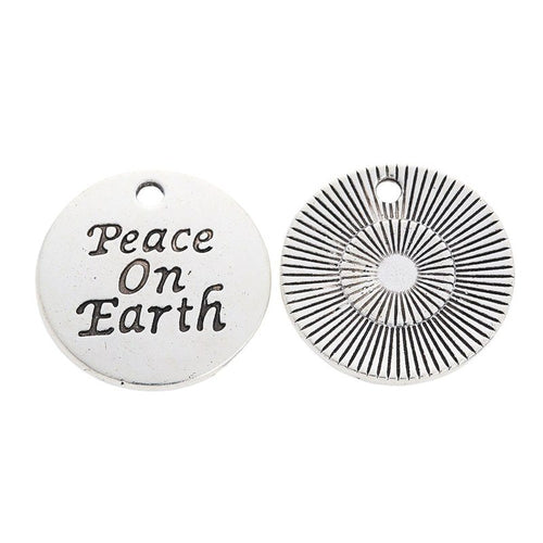 Front detail of peace on earth round metal charm