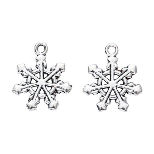 Alternate product view of layered snowflake charms on a white background