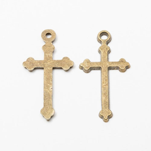 Front detail and finish comparison of the simple cross charm