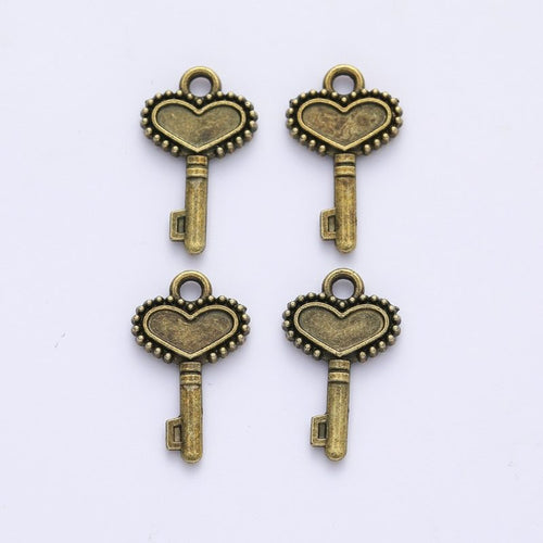 Close view of the beaded heart key charm surface and relief