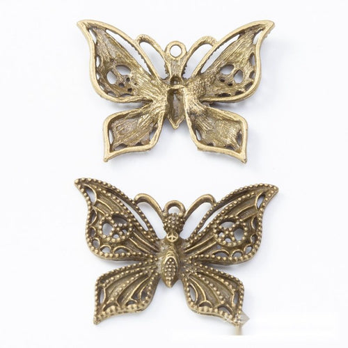 Front and reverse views of the filigree butterfly in one finish