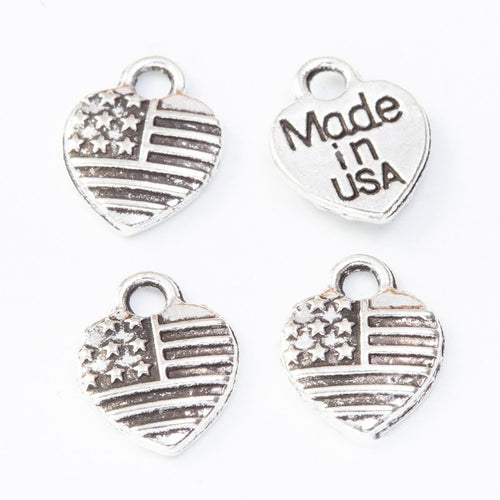 Front detail view of one pictured finish of american flag heart charms