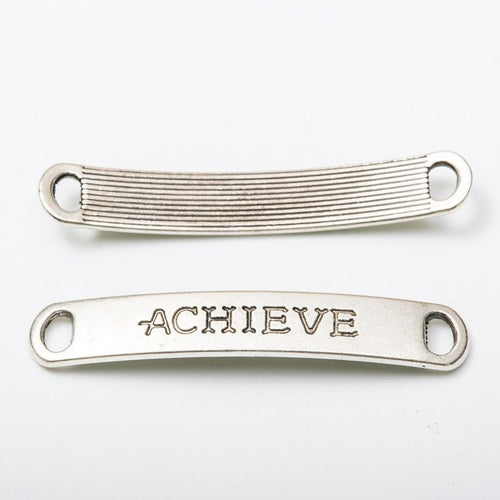 Close view of the a slim rectangular word bar reading ACHIEVE with a loop at each end