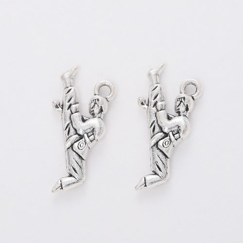 Closer view of the martial artist charm surface and hanging loop
