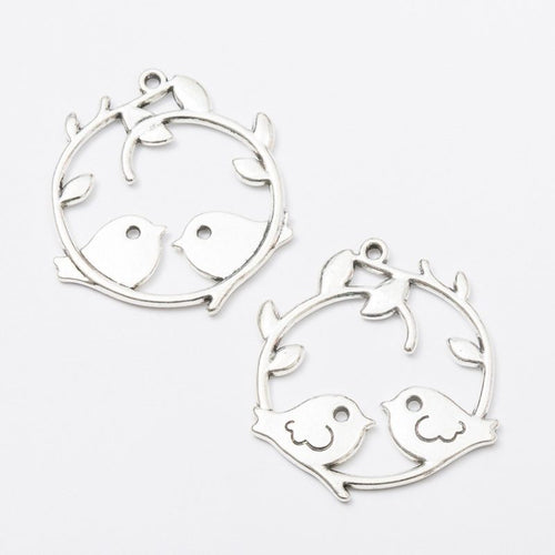 Two Birds Wreath Charm front and reverse details on a white background