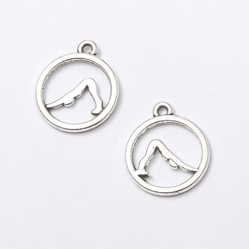 Closer view of the downward dog yoga charm surface and hanging loop