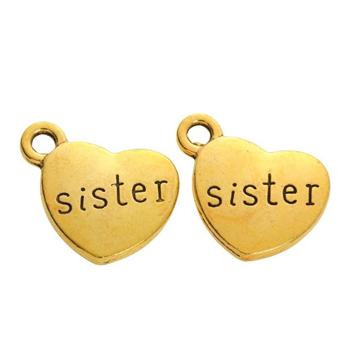 Front detail of sister engraved heart metal charm