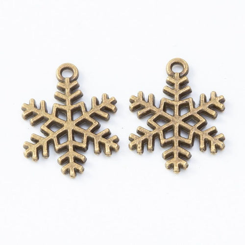 Antique Bronze, Gold Tone, Antique Gold, Antique Silver snowflake charm shown in a detailed product view