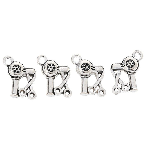 Close view of the hair dryer and scissors charm surface and relief