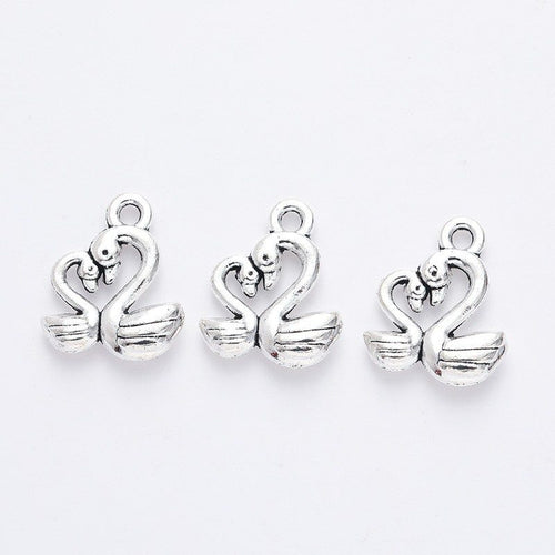 Additional front and reverse view of the heart-neck swan charm