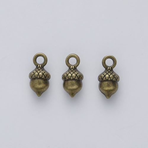 Additional front and reverse view of the acorn charm